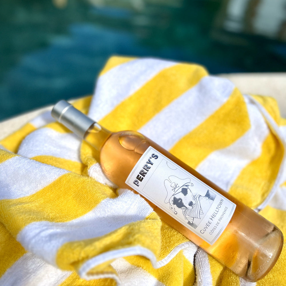 A bottle of Perry's Rose wine by a pool in Palm Springs